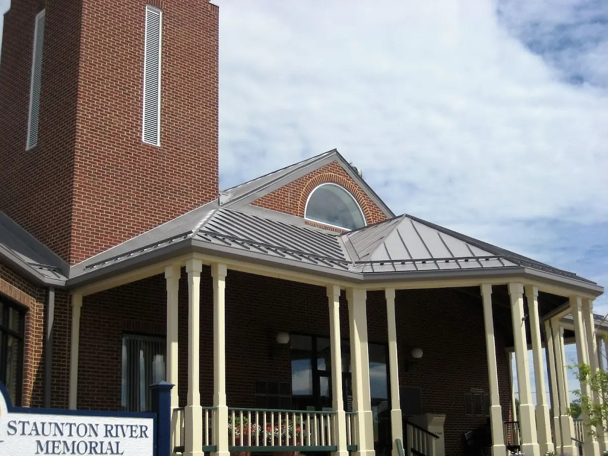 Skilled roofing craftsmen working on a residential roof in Mentcle